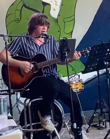 Drew Wilkerson playing guitar